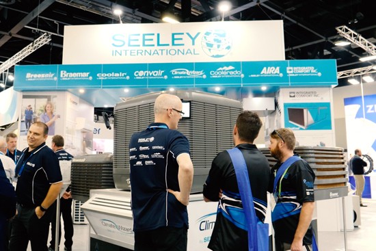 Seeley sales staff talking to customer at trade show